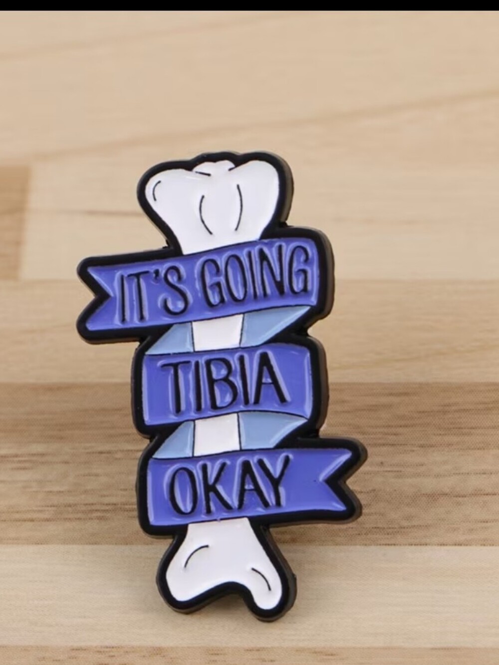 It's Going Tibia Okay Enamel Pin - Purple White Bone Design